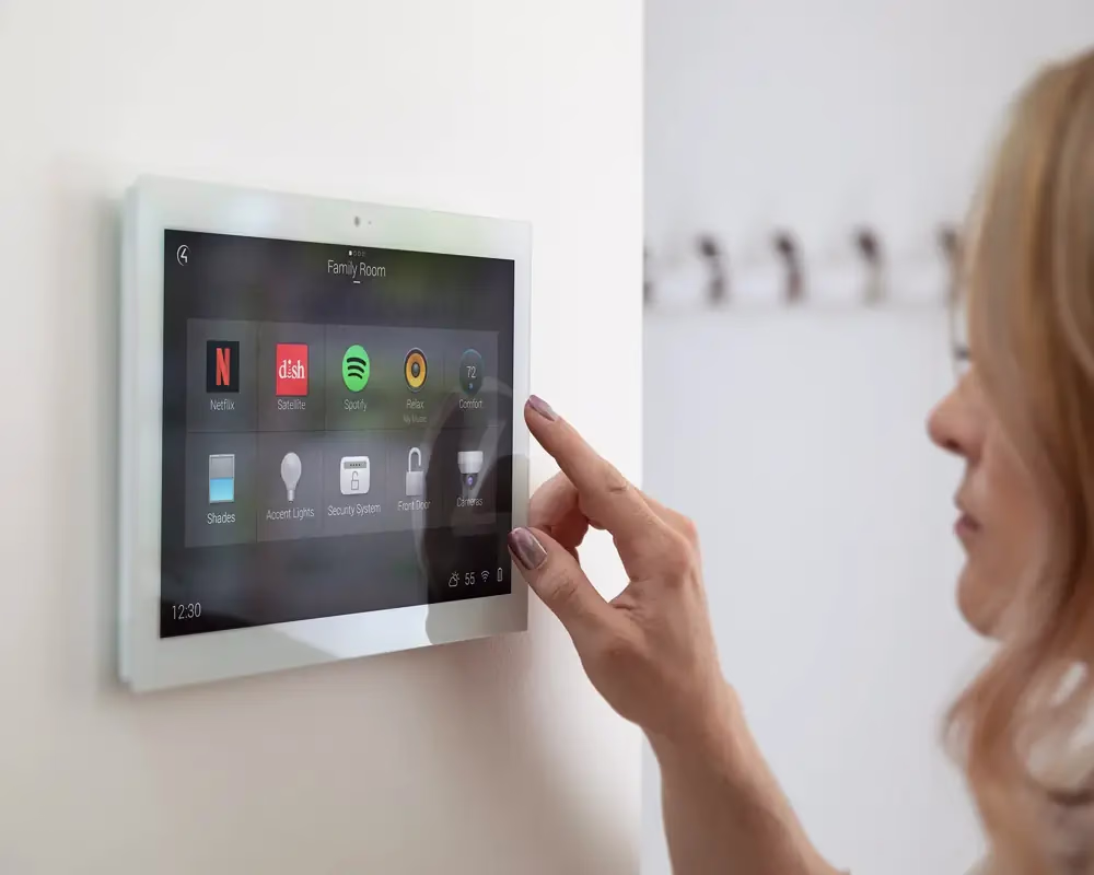 Wall-mounted smart home touch panel controlling lighting, climate and audio